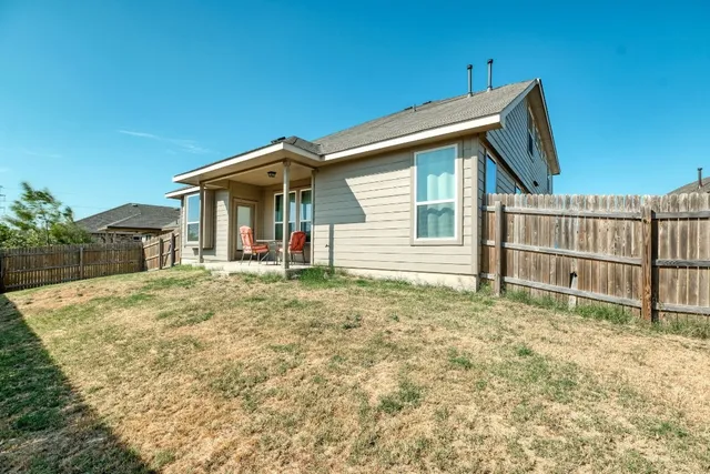 a house with yard in front of it