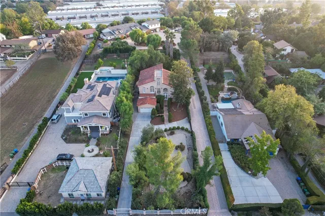 an aerial view of multiple houses with yard