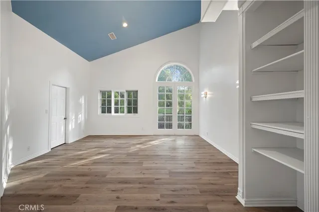 a bathroom with a granite countertop toilet and a sink
