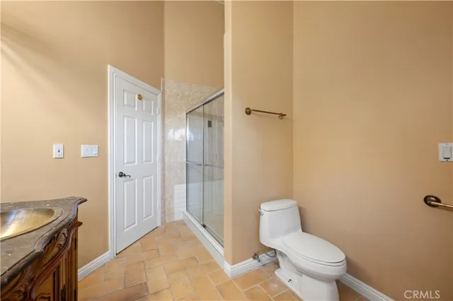 a aerial view of a house with a yard and plants