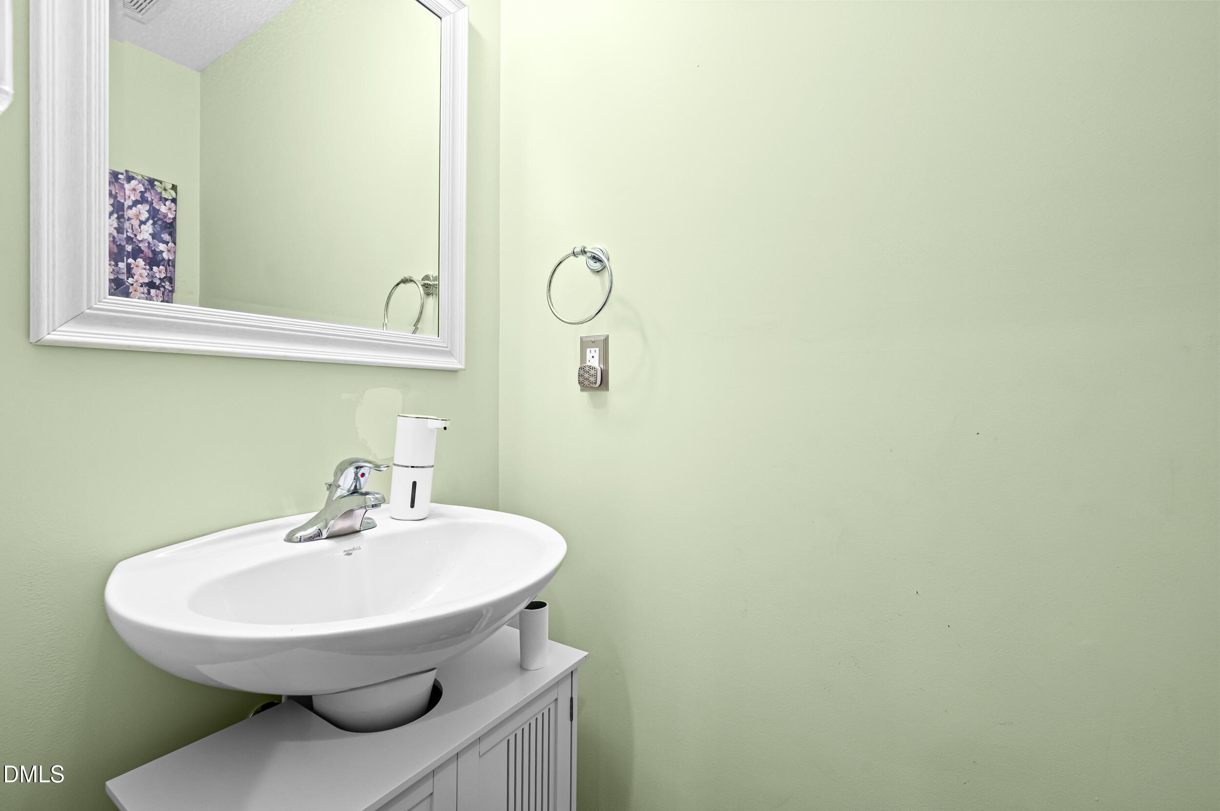 2944 Casona Way Raleigh, NC 27616 - Photo 12 of 24 a bathroom with a sink and a mirror