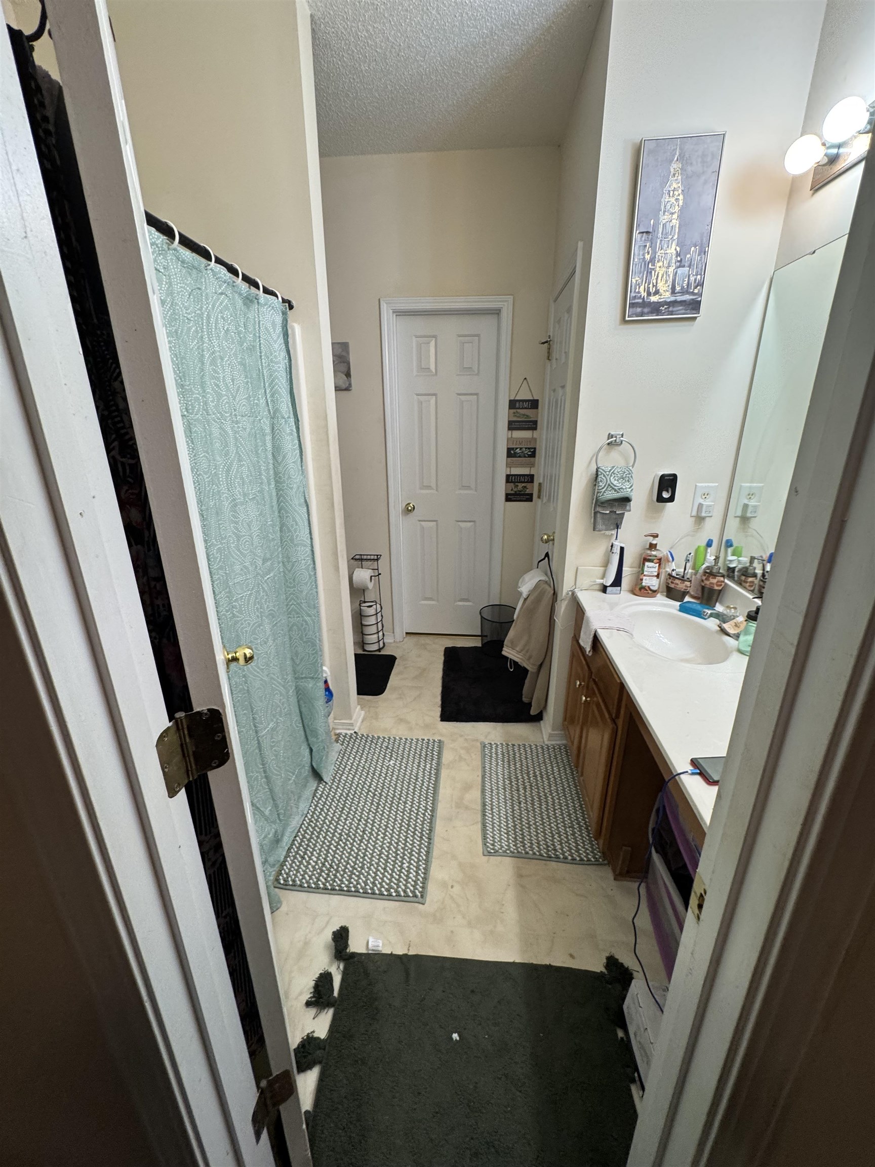 116 Olde Towne Way, Unit 6 Myrtle Beach, SC 29588 - Photo 17 of 23 Full bathroom featuring vanity, curtained shower, and a textured ceiling