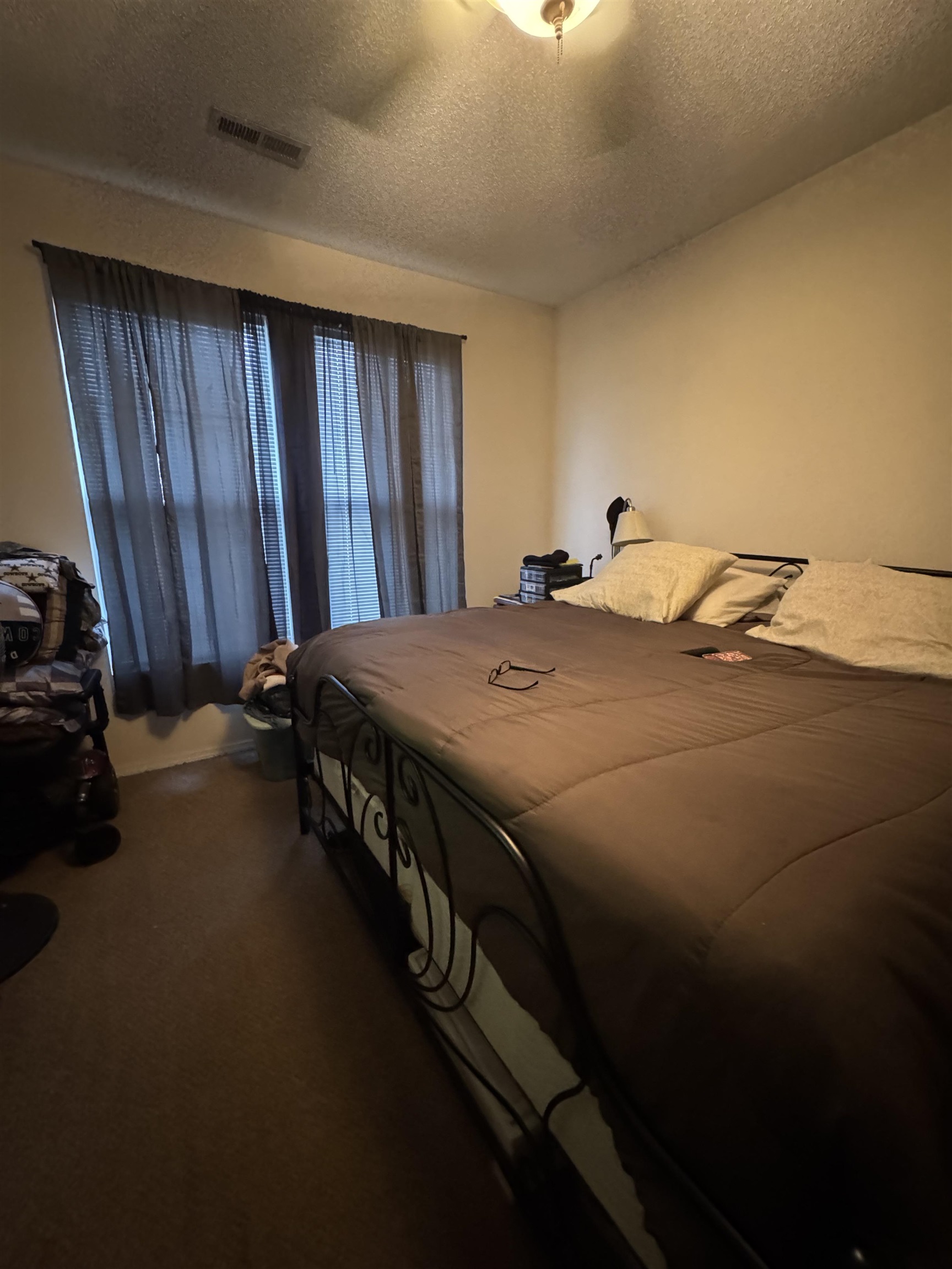 116 Olde Towne Way, Unit 6 Myrtle Beach, SC 29588 - Photo 18 of 23 Carpeted bedroom featuring a textured ceiling