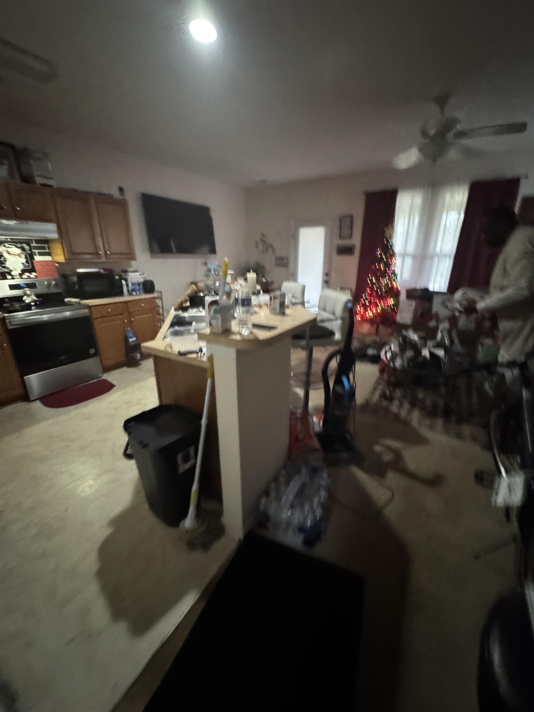 116 Olde Towne Way, Unit 6 Myrtle Beach, SC 29588 - Photo 7 of 23 Kitchen featuring stainless steel electric range oven, light countertops, a center island, concrete floors, and ceiling fan