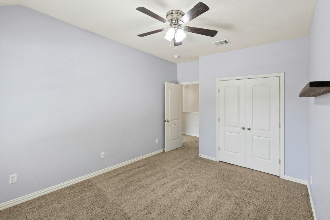 2804 Prosperity Leander, TX 78641 - Photo 27 of 39 Unfurnished bedroom with carpet floors, a closet, baseboards, and a ceiling fan