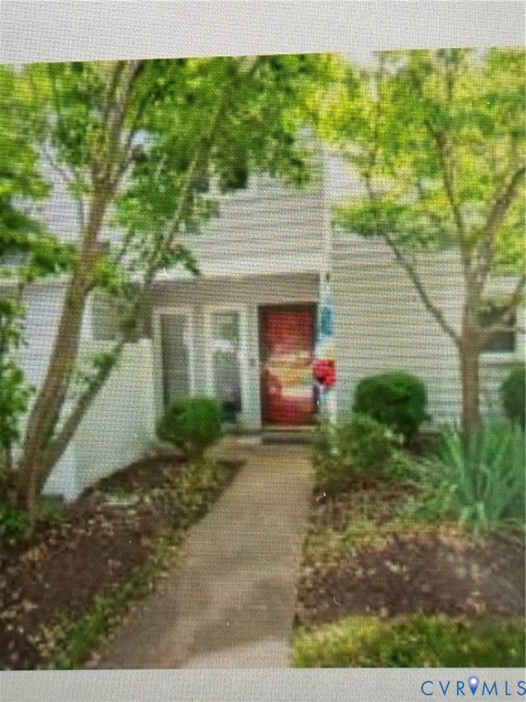 1522 Sycamore Square Drive Midlothian, VA 23113 - Photo 1 of 12 a view of a house with a small yard and a large tree