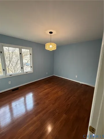 a bathroom with a granite countertop sink toilet a mirror and shower