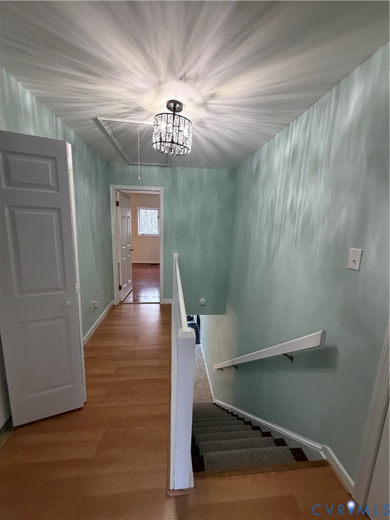 1522 Sycamore Square Drive Midlothian, VA 23113 - Photo 10 of 12 a view of a hallway with wooden floor and staircase