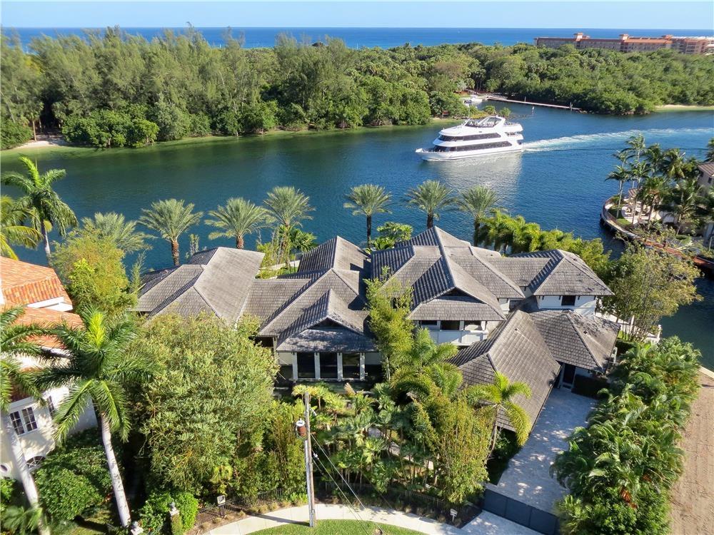 880 Northeast 33rd Street Boca Raton, FL 33431 - Photo 1 of 1 an aerial view of a house with a lake view