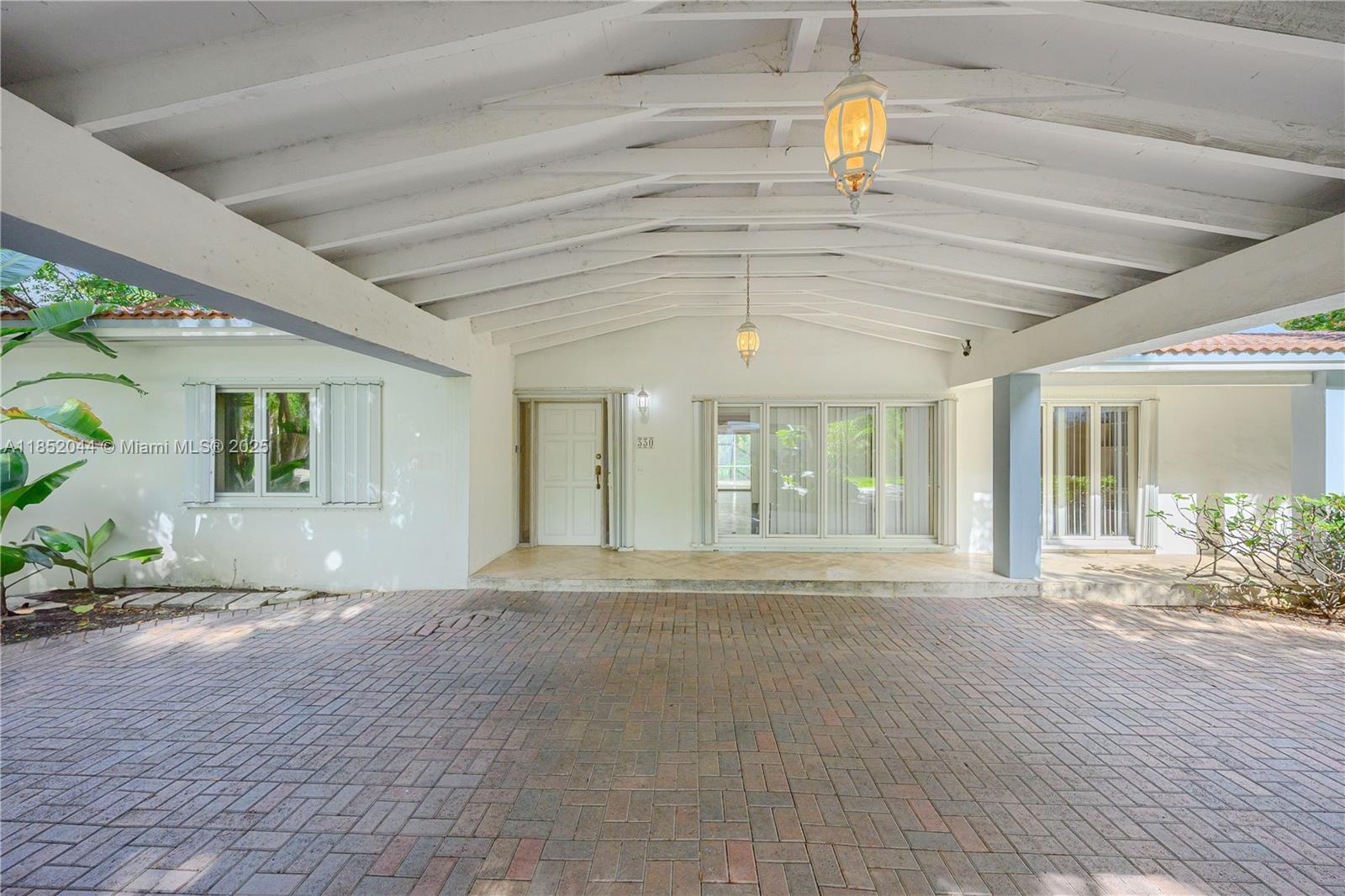 330 Pacific Road Key Biscayne, FL 33149 - Photo 3 of 41 a view of an entrance of the house