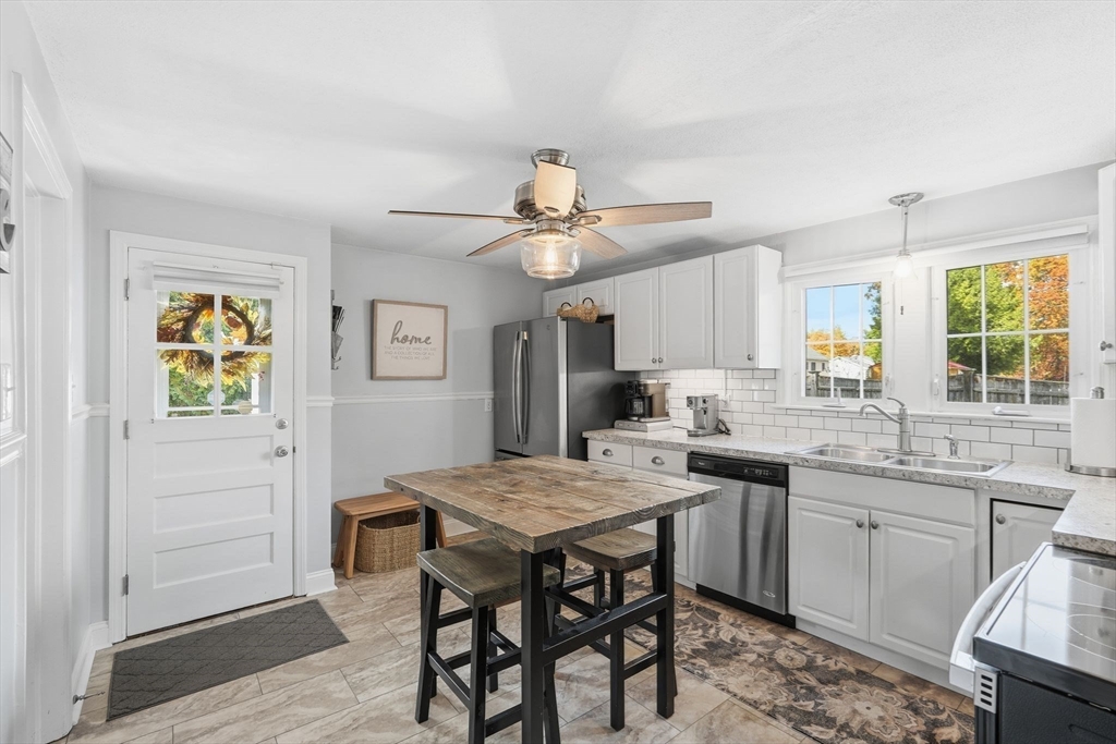 42 Redstone Drive Springfield, MA 01118 - Photo 12 of 37 a kitchen with a table and chairs in it
