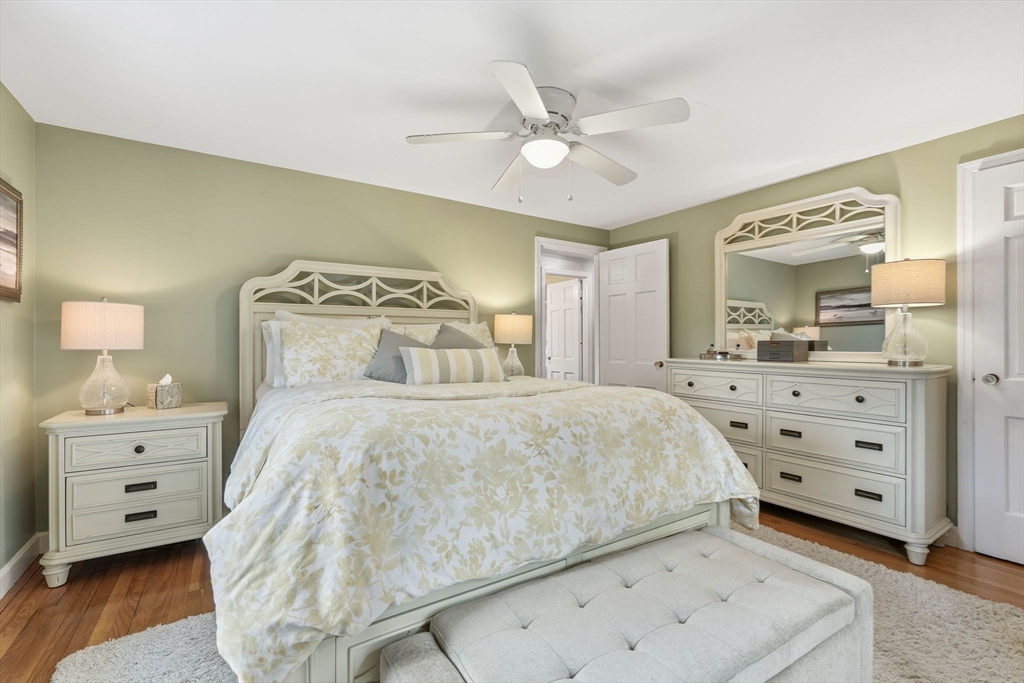 42 Redstone Drive Springfield, MA 01118 - Photo 19 of 37 a bedroom with a bed and a chandelier