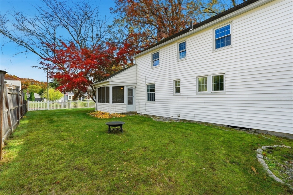 42 Redstone Drive Springfield, MA 01118 - Photo 32 of 37 a backyard of a house with table and chairs