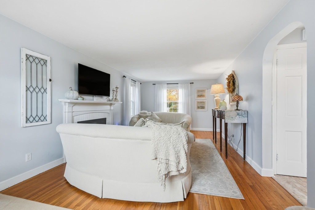 42 Redstone Drive Springfield, MA 01118 - Photo 7 of 37 a living room with furniture and a flat screen tv