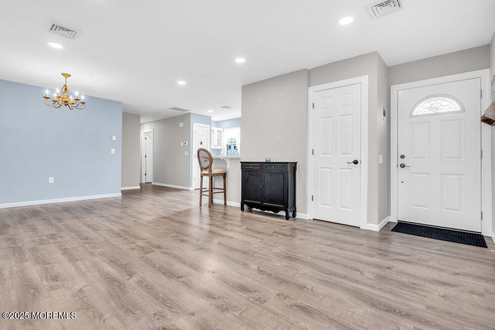 69 D Sunset Road, Unit 60 Whiting, NJ 08759 - Photo 5 of 19 a view of livingroom with furniture and wooden floor