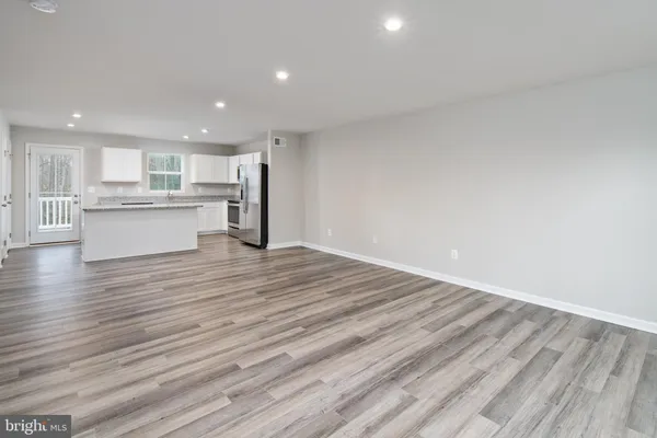 a view of kitchen and wooden floor