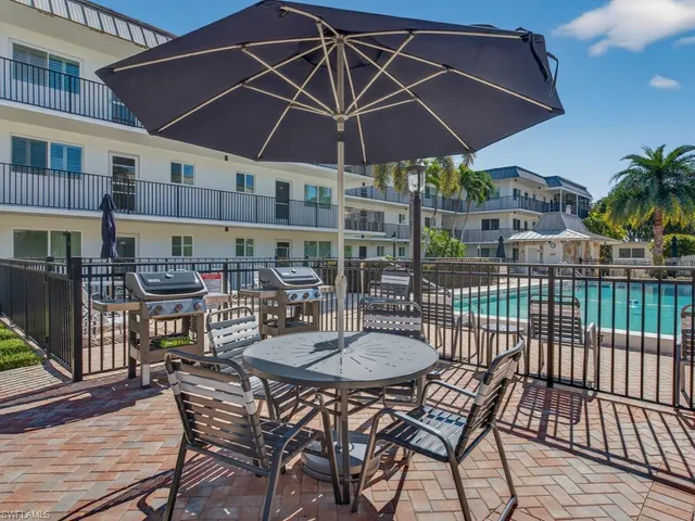 a view of pool with outdoor seating