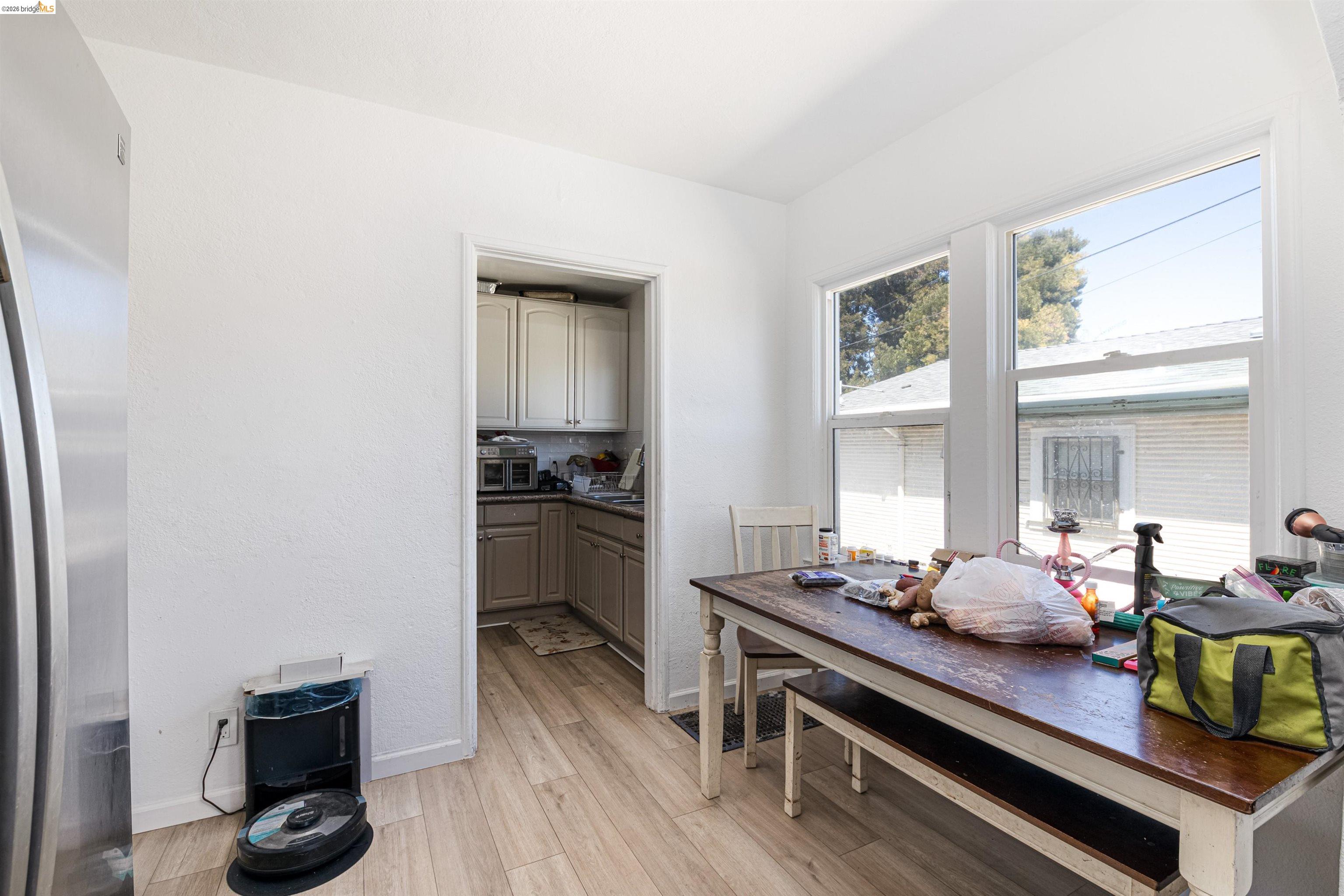 1821 74th Avenue Oakland, CA 94621 - Photo 19 of 27 Dining room with light wood finished floors and baseboards