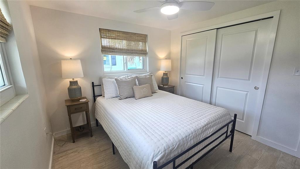 1210 Maryknoll Road Englewood, FL 34223 - Photo 27 of 37 a bedroom with a bed and a window