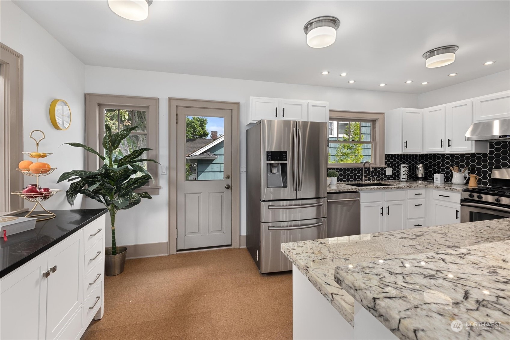 5916 8th Avenue Northeast Seattle, WA 98105 - Photo 13 of 40 a kitchen with refrigerator and cabinets