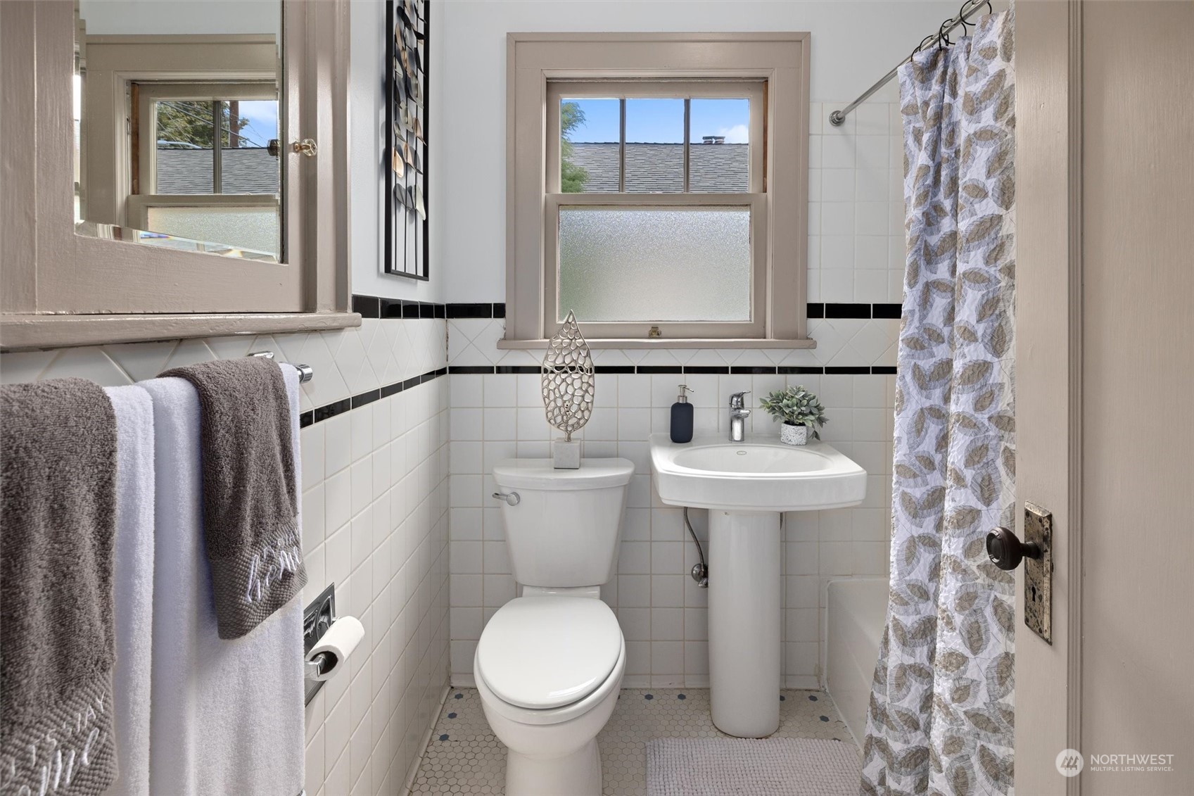 5916 8th Avenue Northeast Seattle, WA 98105 - Photo 18 of 40 a bathroom with a sink and mirror with toilet