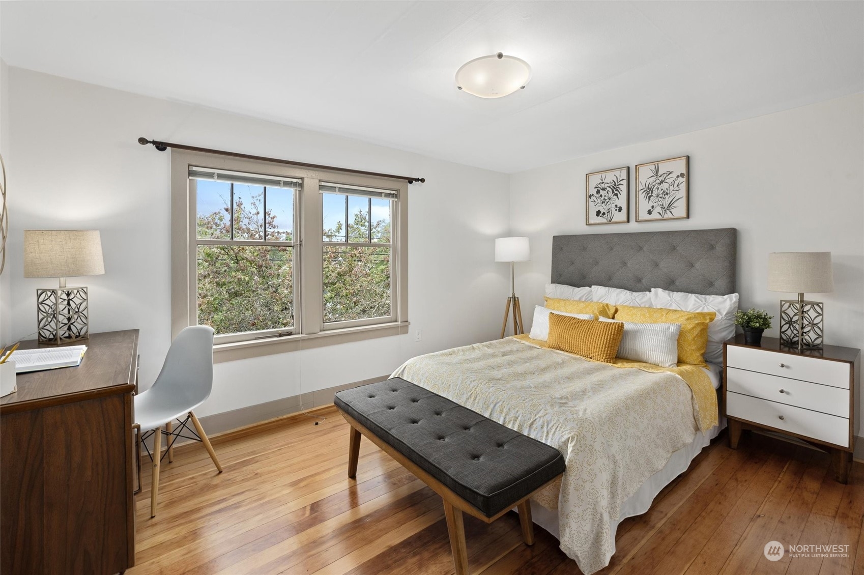 5916 8th Avenue Northeast Seattle, WA 98105 - Photo 20 of 40 a bedroom with a bed a table and a window