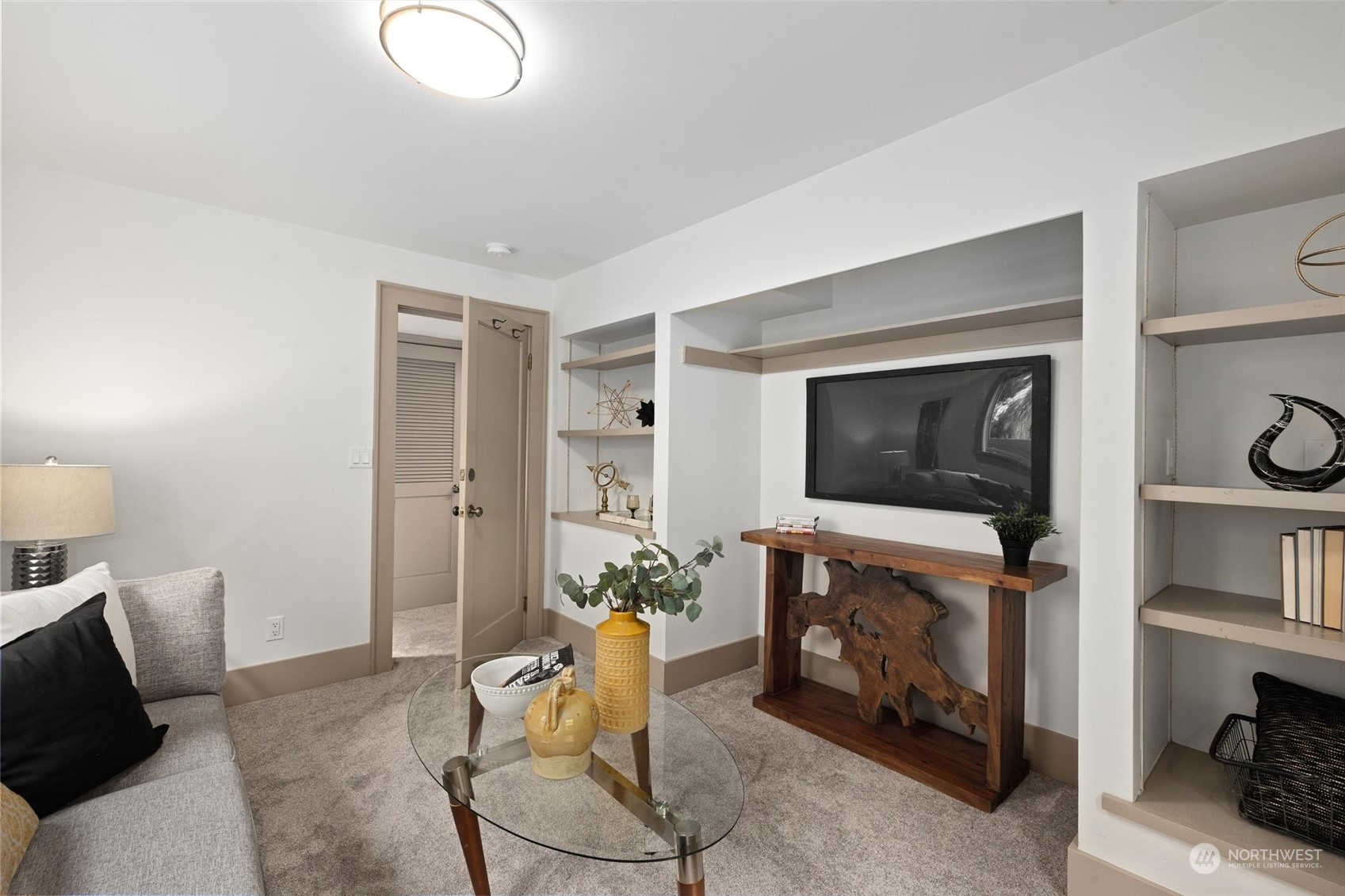 5916 8th Avenue Northeast Seattle, WA 98105 - Photo 31 of 40 a living room with furniture and a fireplace
