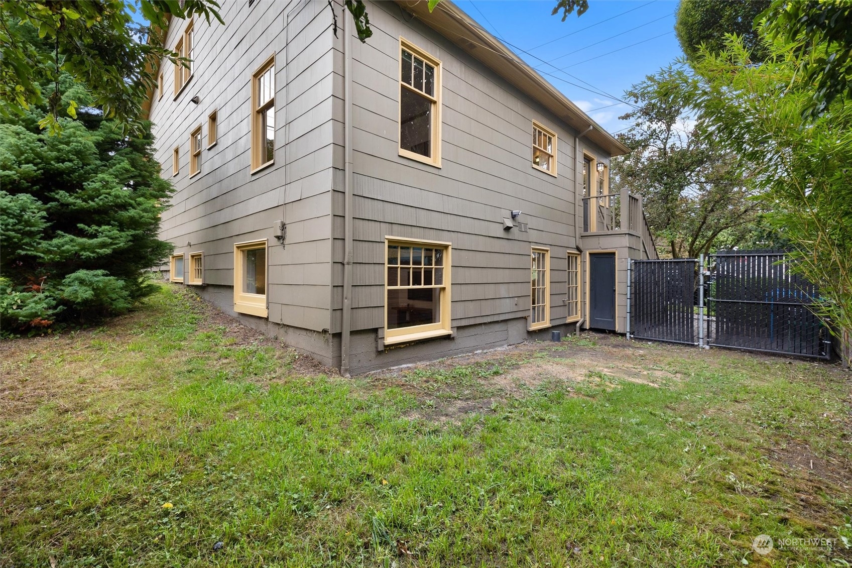 5916 8th Avenue Northeast Seattle, WA 98105 - Photo 35 of 40 a view of a house with a backyard