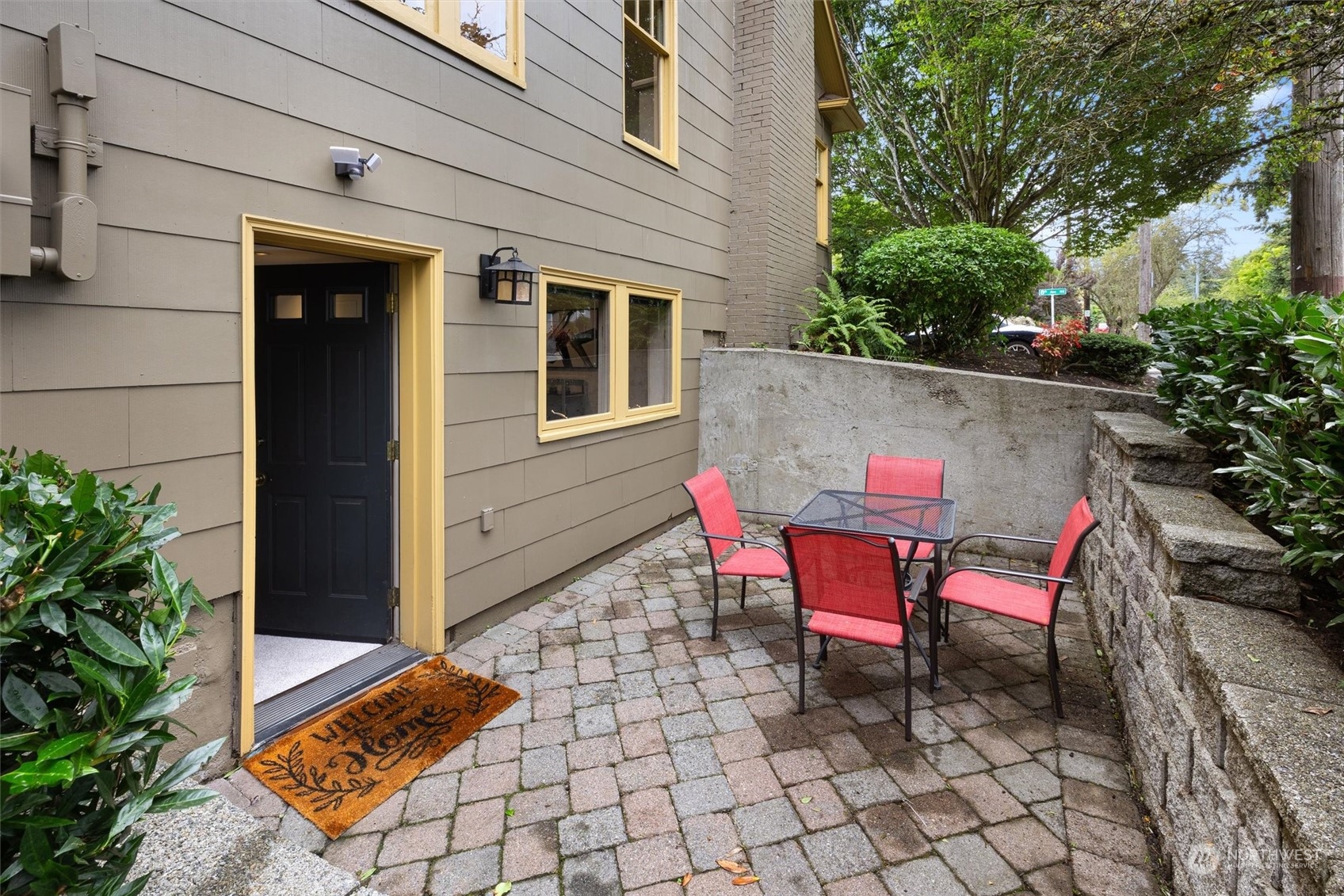 5916 8th Avenue Northeast Seattle, WA 98105 - Photo 36 of 40 a couple of chairs sitting in front of a house