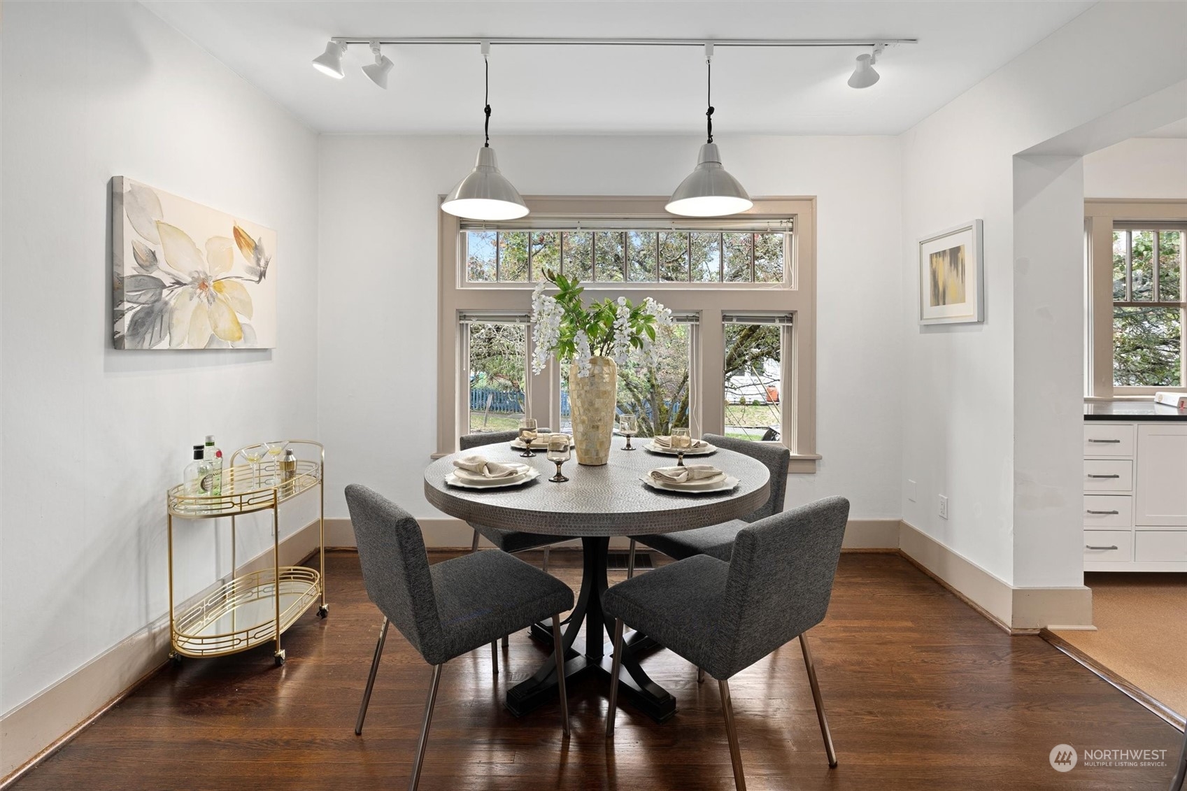 5916 8th Avenue Northeast Seattle, WA 98105 - Photo 8 of 40 a view of a dining room with furniture wooden floor and chandelier