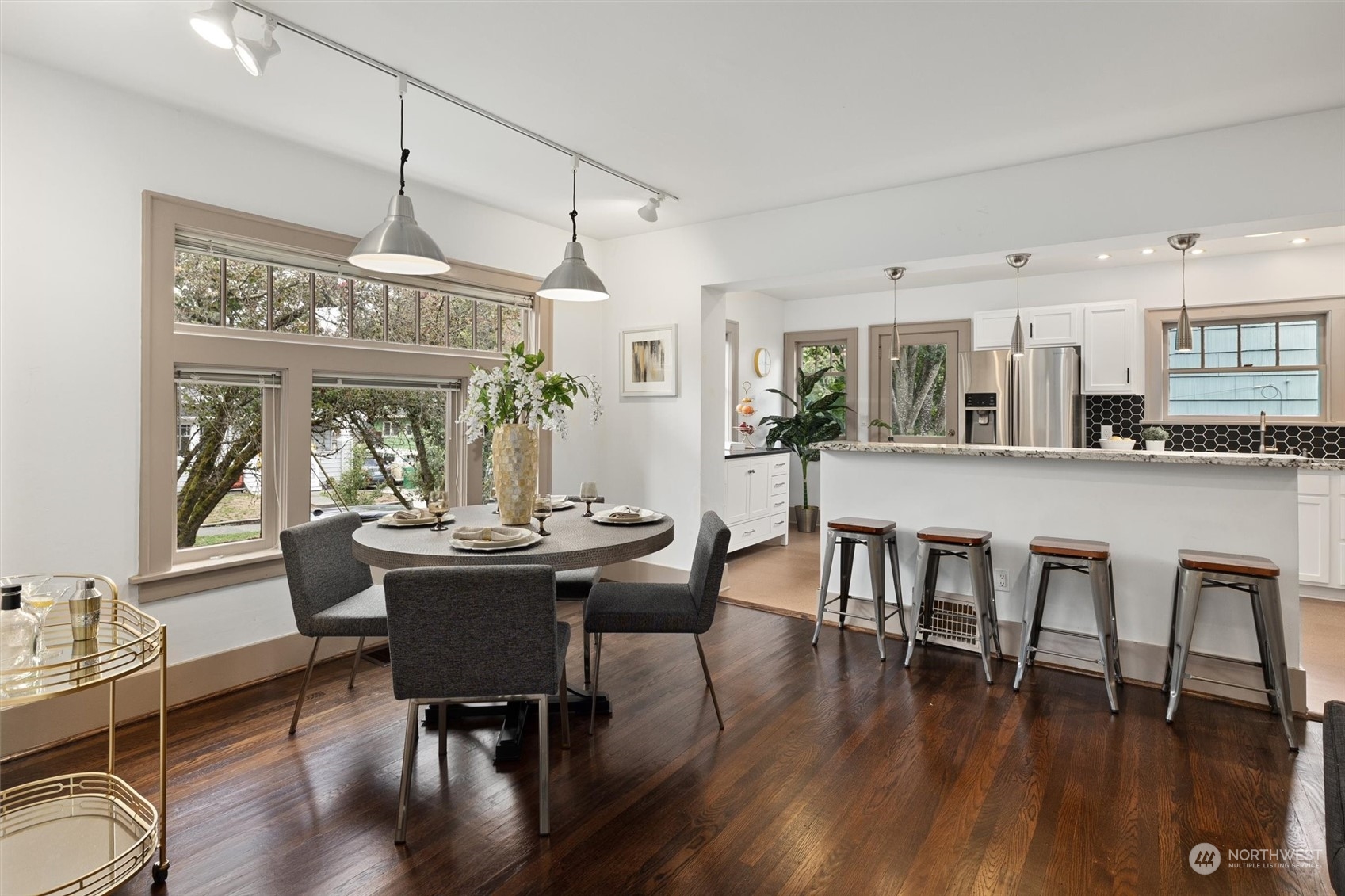 5916 8th Avenue Northeast Seattle, WA 98105 - Photo 9 of 40 a view of a dining room with furniture window and wooden floor