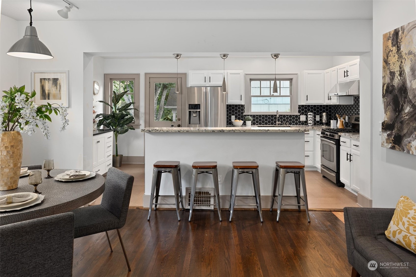 5916 8th Avenue Northeast Seattle, WA 98105 - Photo 10 of 40 a dining room with furniture and wooden floor