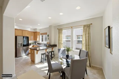 a view of a dining room with furniture window and outside view