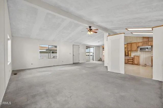 a large kitchen with cabinets and a stove