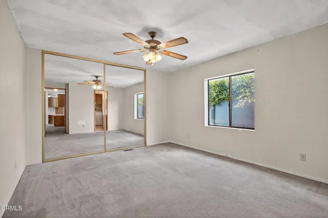 a view of washer and dryer with kitchen in the background