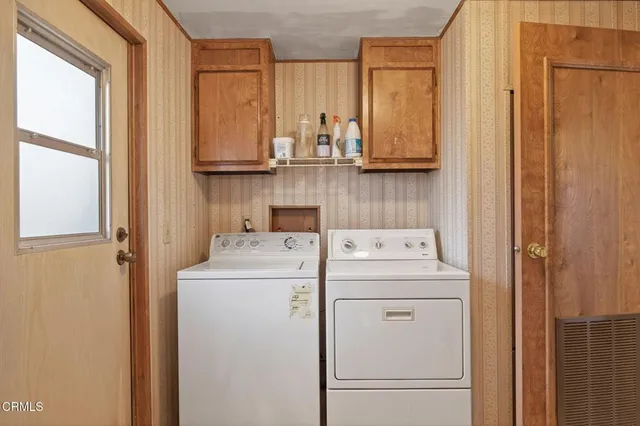 a utility room with dryer and washer