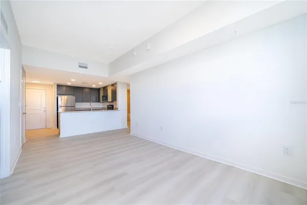 a view of a kitchen with wooden floor