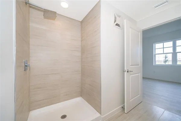 a bathroom with a bath tub and a shower