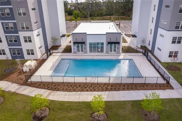 a aerial view of a house with a swimming pool