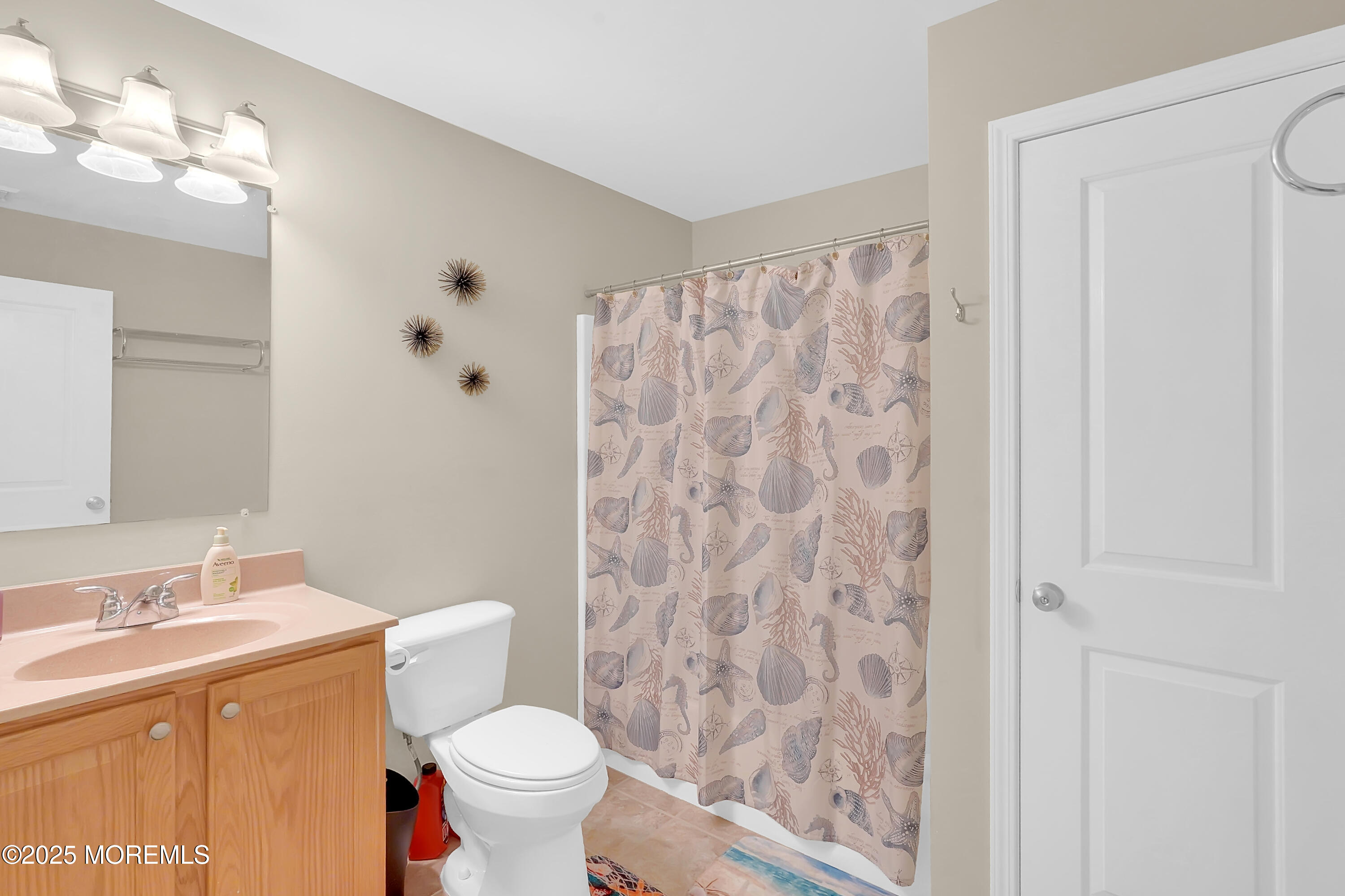 419 Coolidge Avenue Seaside Heights, NJ 08751 - Photo 19 of 82 a bathroom with a granite countertop toilet a sink a shower and a mirror