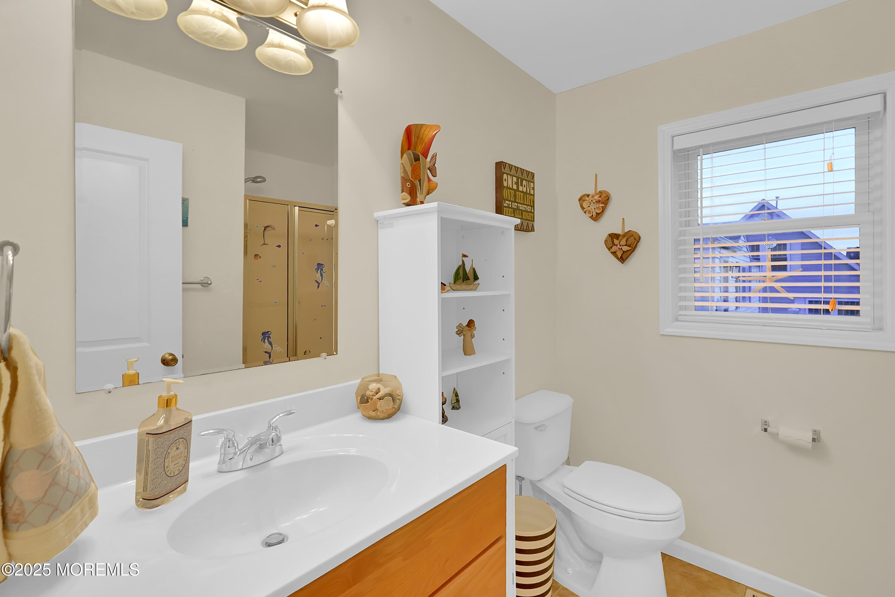 419 Coolidge Avenue Seaside Heights, NJ 08751 - Photo 2 of 82 a bathroom with a sink a toilet and a mirror