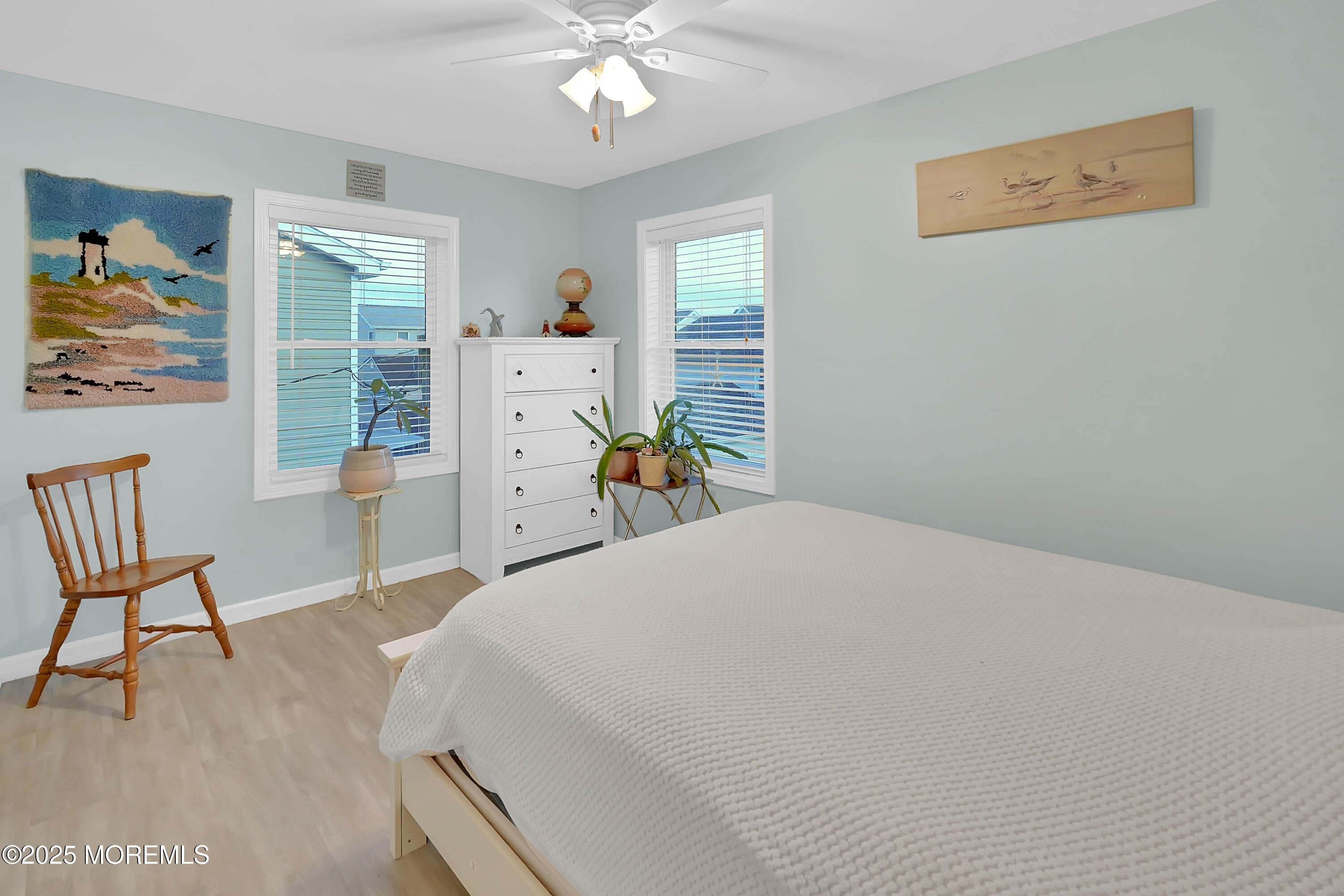 419 Coolidge Avenue Seaside Heights, NJ 08751 - Photo 48 of 82 a bedroom with a bed and a chandelier