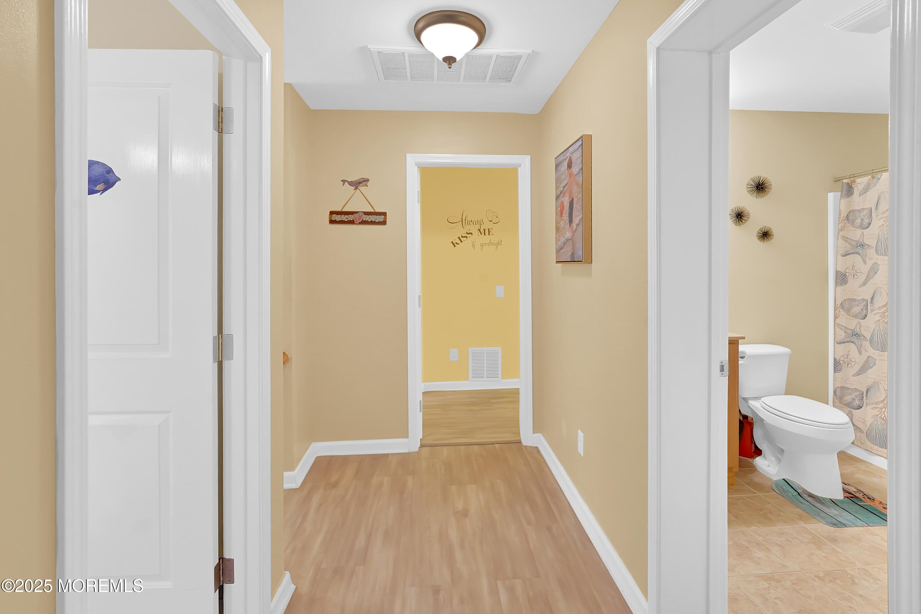 419 Coolidge Avenue Seaside Heights, NJ 08751 - Photo 7 of 82 a view of a bathroom with a hardwood floor and a bathroom