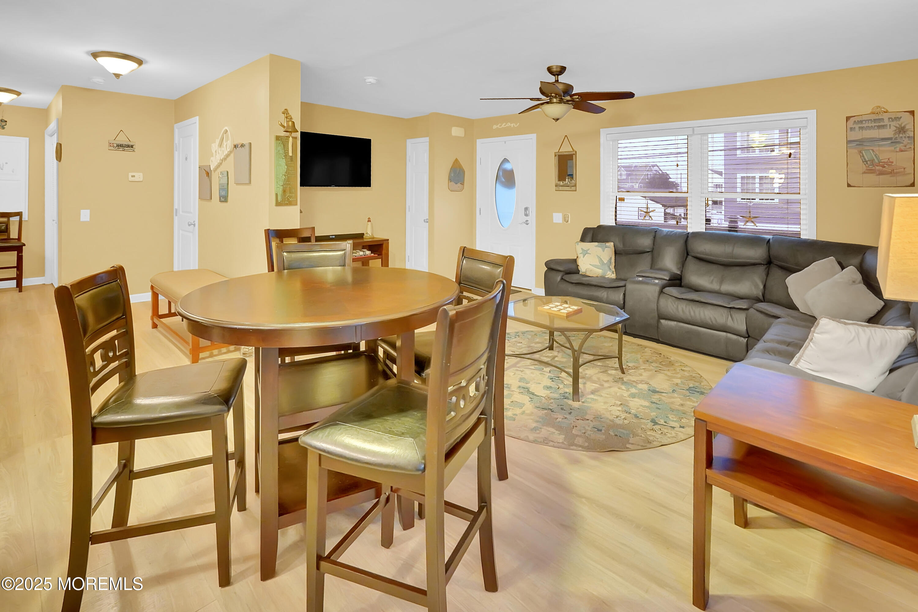 419 Coolidge Avenue Seaside Heights, NJ 08751 - Photo 81 of 82 a living room with furniture a flat screen tv and a table