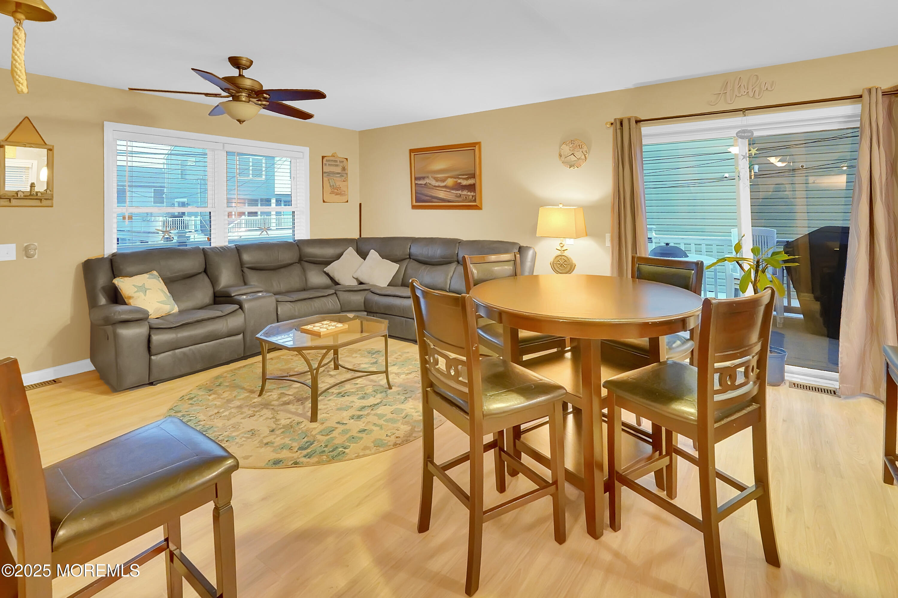419 Coolidge Avenue Seaside Heights, NJ 08751 - Photo 82 of 82 a living room with furniture a table and a large window