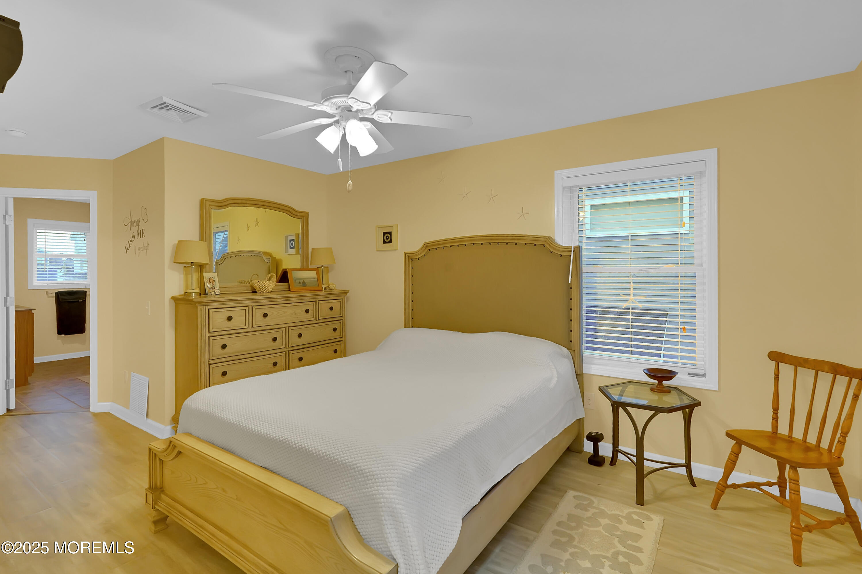419 Coolidge Avenue Seaside Heights, NJ 08751 - Photo 9 of 82 a bedroom with a bed and a chandelier