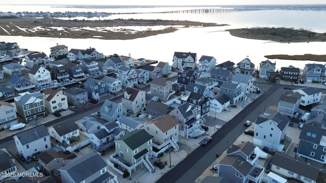 a view of building with outdoor space and parking