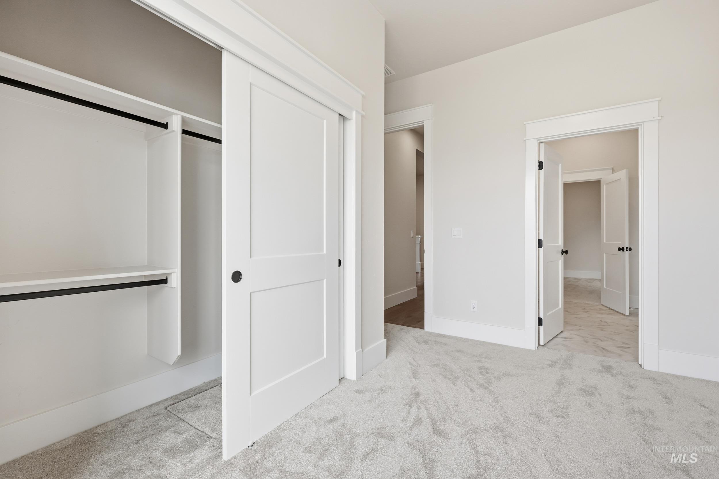6513 South Utmost Way Meridian, ID 83642 - Photo 30 of 47 Unfurnished bedroom featuring light colored carpet and a closet