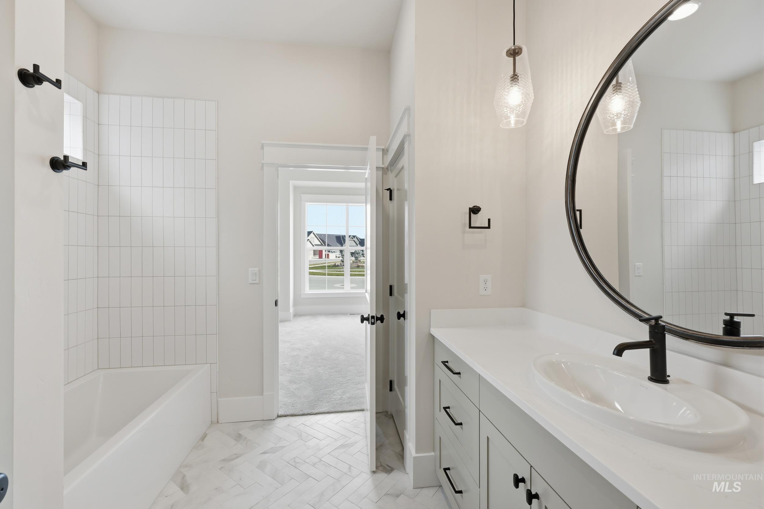 6513 South Utmost Way Meridian, ID 83642 - Photo 31 of 47 Full bathroom with vanity, shower / washtub combination, and light marble finish flooring