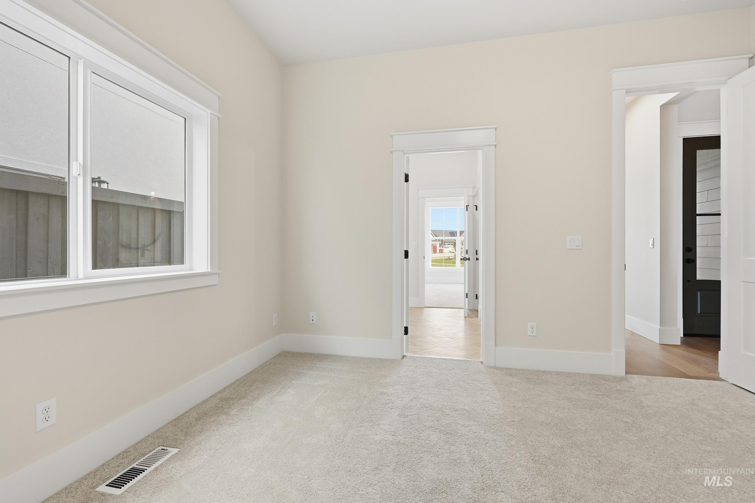 6513 South Utmost Way Meridian, ID 83642 - Photo 33 of 47 Unfurnished room featuring light carpet and baseboards